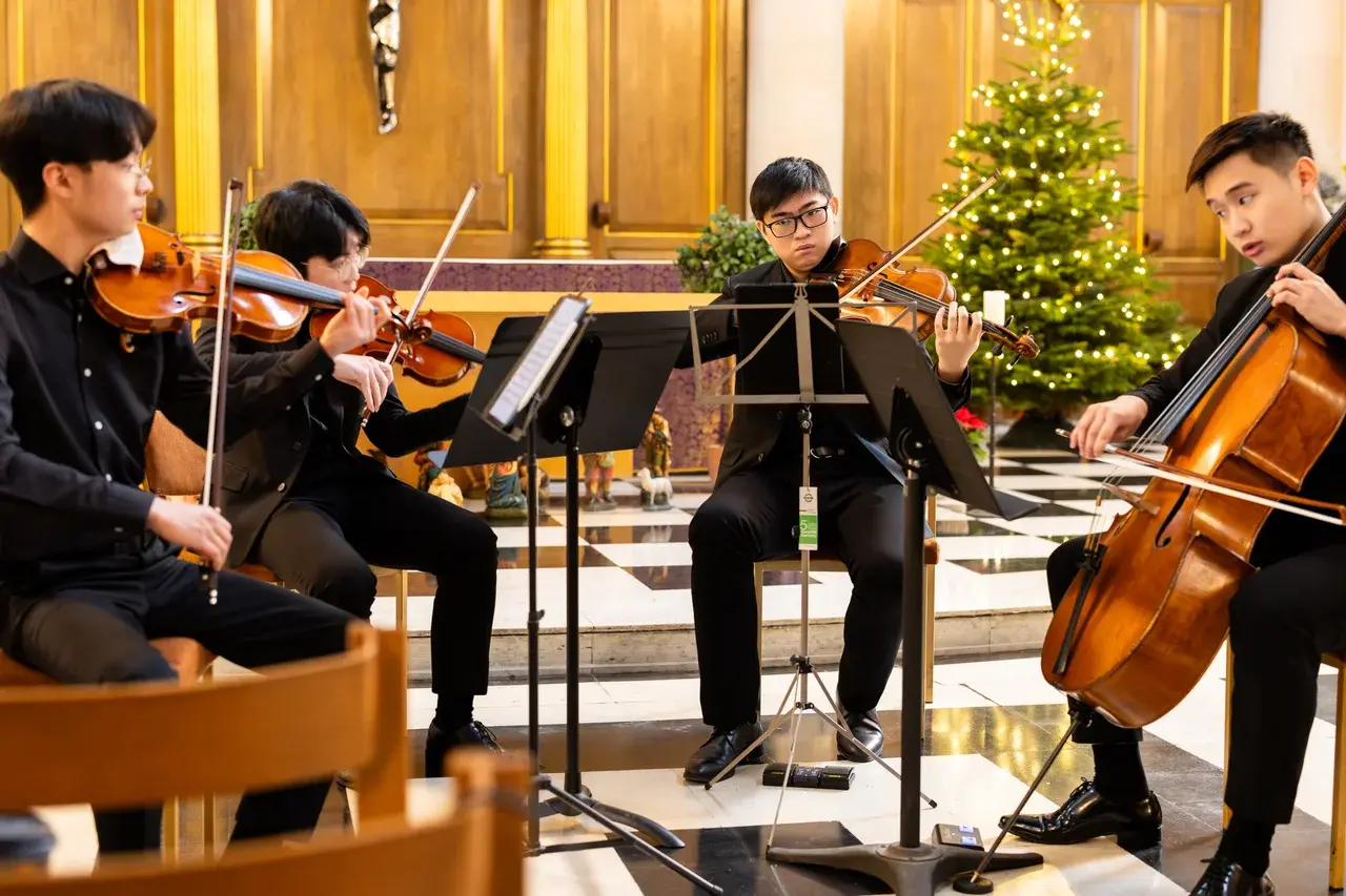 Sean Lee playing viola in a string quartet